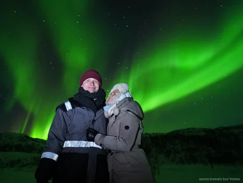 Group on the Tromso Northern Lights unlimited chase tour watching the aurora borealis