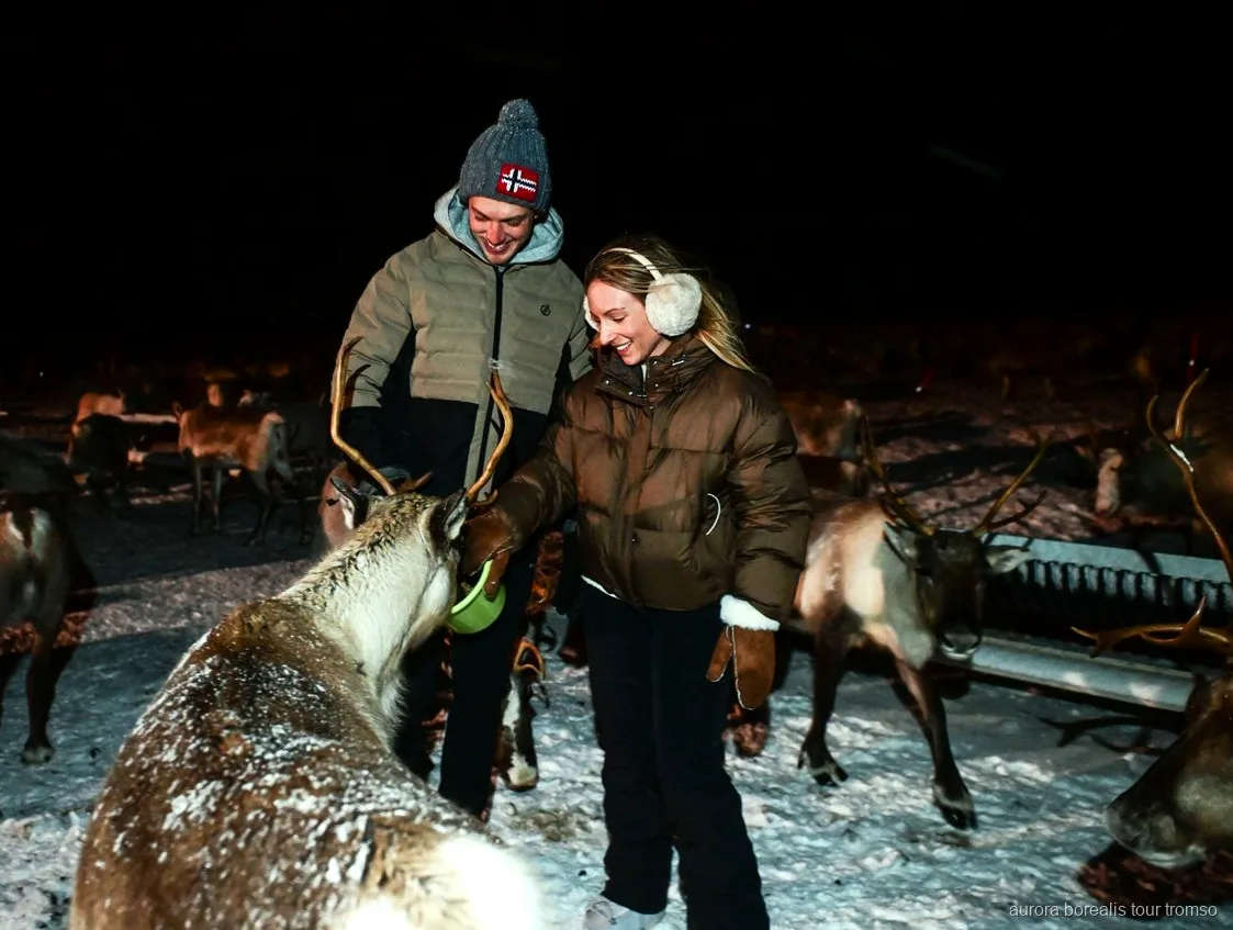 Sami guide performing a joik around the fire near Tromso